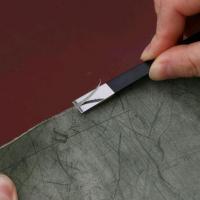 Couteau a amincr le cuir